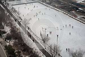 aerials of an ice rink with skaters in motion