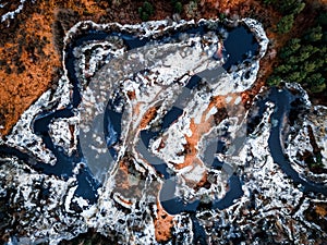 aero drone view of a flooded river during winter, showcasing the powerful and destructive forces of nature