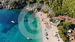 Aero. top view. beautiful summer seascape. wild beach of Evia island, Greece. sea bay with turquoise, blue water at foot