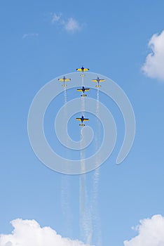 Aerobatic air plane on blue sky, aerobatic pilots synchronise