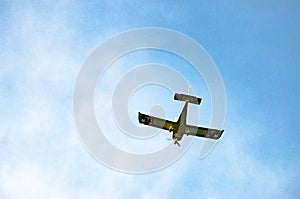 Aerobatic plane flying high in the sky