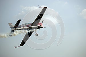 Aerobatic plane trailing smoke