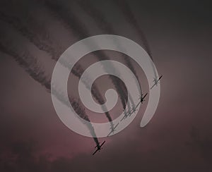 Aerobatic planes at sunset