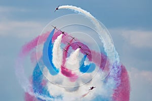 Aerobatic team at airshow. Flight demonstration and formation flying. Air force and military show. Airport and air base. Aviation