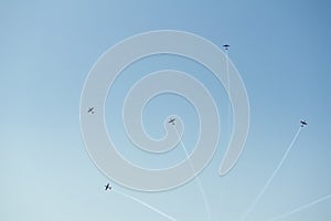 Aerobatics - Group of aerobatic plane, airplane and aircraft are doing manoeuvres on clear blue sky