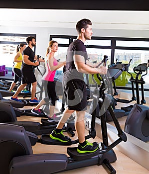 Aerobics elliptical walker trainer group at gym
