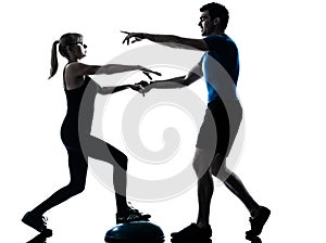 Aerobics intstructor with mature woman exercising