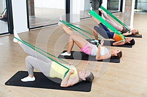 Aerobics pilates women with rubber bands