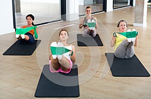 Aerobics pilates women with rubber bands