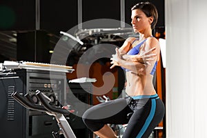 Aerobics spinning monitor trainer woman stretching