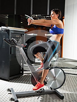 Aerobics spinning monitor trainer woman stretching