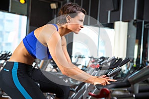 Aerobics spinning woman exercise workout at gym