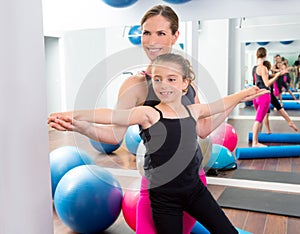 Aerobics woman personal trainer of children girl