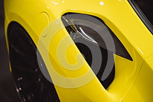 Aerodynamic yellow exotic supercar carbon part