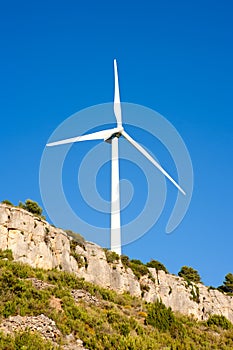 Aerogenerator windmill in rocky mountain photo