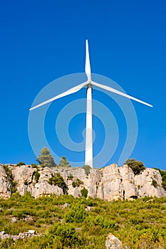 Aerogenerator windmill in rocky mountain photo