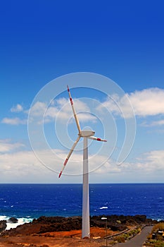 Aerogenerator windmills in front of ocean sea photo