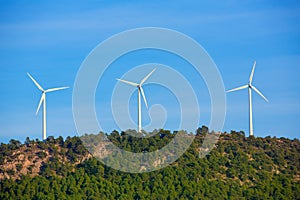 Aerogenerator windmills in the mountain top photo