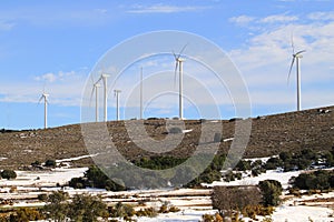 Aerogenerator windmills on snow mountain