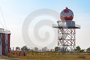 Aeronautical meteorological station tower with spherical radar at airport