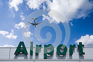 Aeroplane Clouds And Airport sign