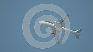 Aeroplane flying in clean blue sky background, bottom view. Action. Airbus flying in the sky, concept of transportation.