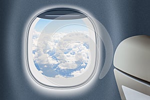 Aeroplane or jet window with clouds behind, traveling concept.