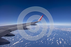 Aeroplane wing view from window beautiful sky. Traveling concept