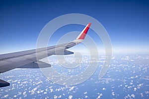 Aeroplane wing view from window beautiful sky. Traveling concept