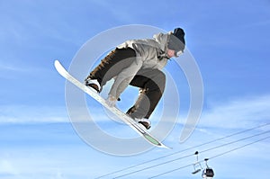 Aeroski: girl snowboarder on a high jump