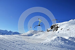 Aeroski: skier in pale green on jump