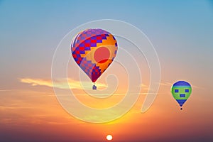 Aerostatic Balloons flying at sunrise