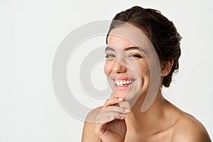 Happy Latin young woman with freckles on face isolated on white. Portrait.