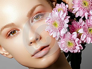 Aesthetic Cosmetology. Spring Woman. Beauty Summer model girl with colorful flowers . Beautiful Lady with Blooming