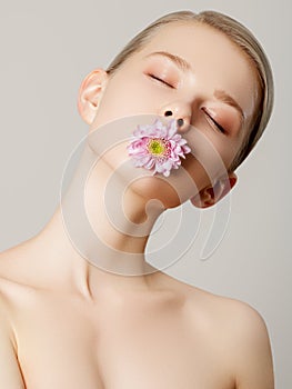 Aesthetic Cosmetology. Spring Woman. Beauty Summer model girl with colorful flowers . Beautiful Lady with Blooming