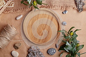 Aesthetic wooden mock up, template tray, brown natural sustainable products. Natural tree bark, green leaves, pebbles