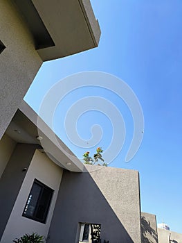 Aesthetically built luxury villa and it's green lawn in the winter afternoon sunlight photo