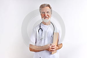 Affable friendly caucasian elderly doctor man in uniform stand looking at camera