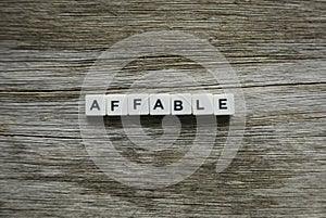 Affable word made of square letter word on wooden background