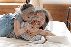 Affectionate bonding family of two enjoy tender moment.