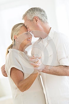 Affectionate Couple Dancing At Home