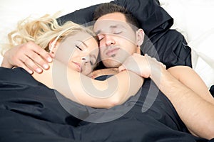 Affectionate couple enjoying a blissful sleep