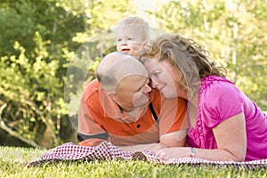 Affectionate Couple with Son in Park