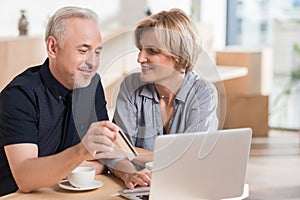 affectionate couple wanting to buy something online and pay