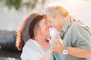 Affectionate Middle Aged Couple Enjoy A Romantic Slow Dance Outside