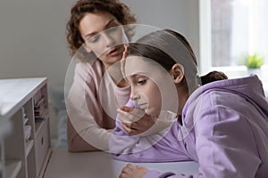 Affectionate mother giving psychological support to depressed daughter.