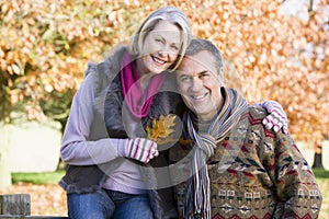 Affectionate senior couple on autumn walk