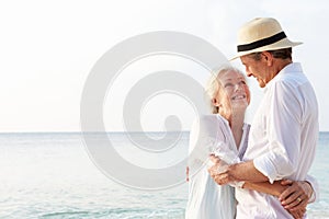 Affectionate Senior Couple On Tropical Beach Holiday