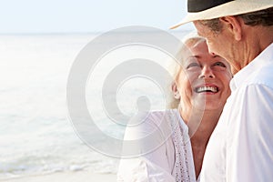 Affectionate Senior Couple On Tropical Beach Holiday