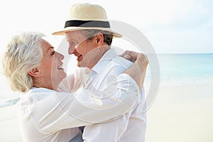 Affectionate Senior Couple On Tropical Beach Holiday photo